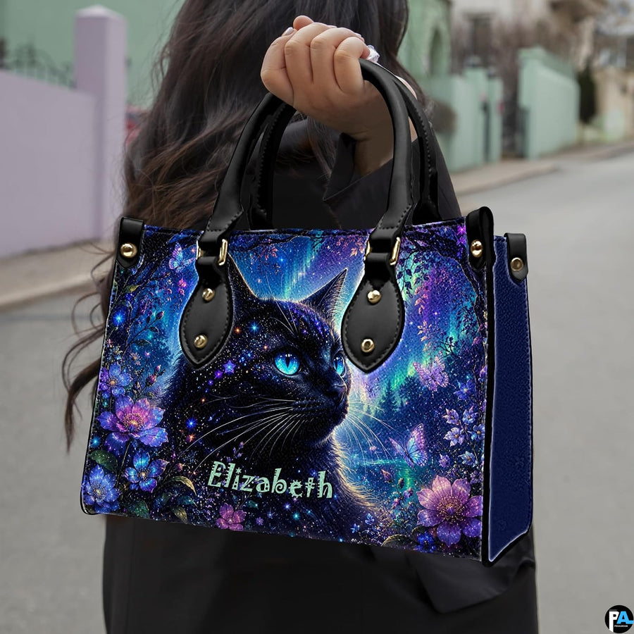 Outdoor presentation showing aurora cat artwork held during an urban walk.