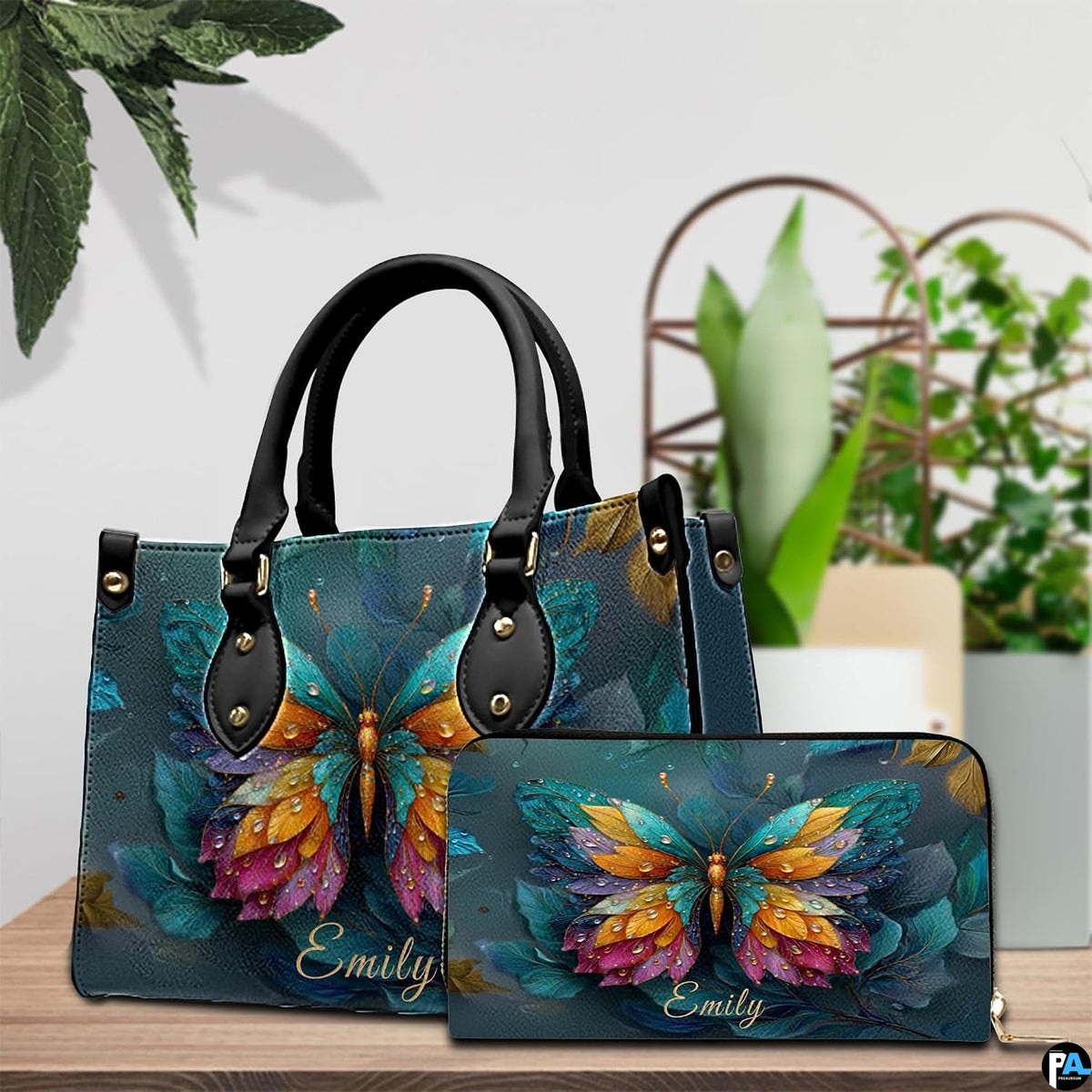 Butterfly handbag and matching wallet displayed together on tabletop setting