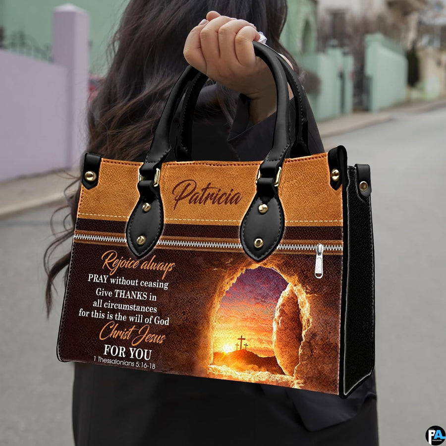 Model carrying the empty tomb resurrection Christian handbag with dual top handles outdoors