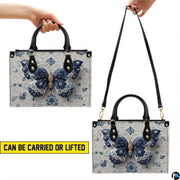 Bottom view of porcelain butterfly handbag showing flat rectangular base