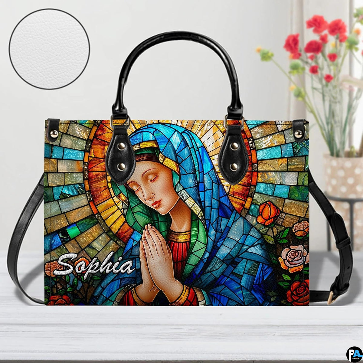 Tabletop presentation of religious art accessory accompanied by round material texture circular inset.