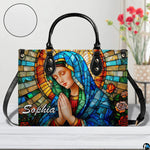 Tabletop presentation of religious art accessory accompanied by round material texture circular inset.