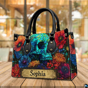 Stained glass skull handbag displayed on wooden plank table before indoor window.
