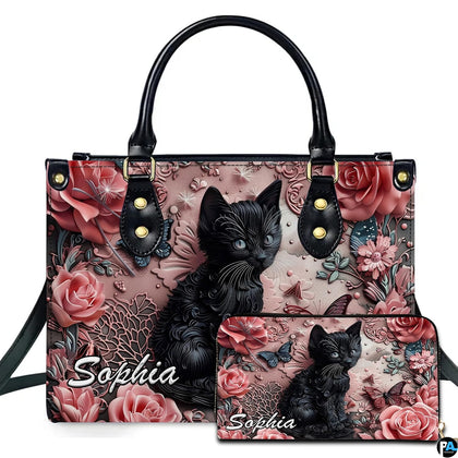 Textured black kitten resting among sculpted dusty pink roses and lace filigree relief art.