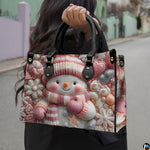 Outdoor handheld perspective showcasing the festive pink snowman candy illustration under natural daylight