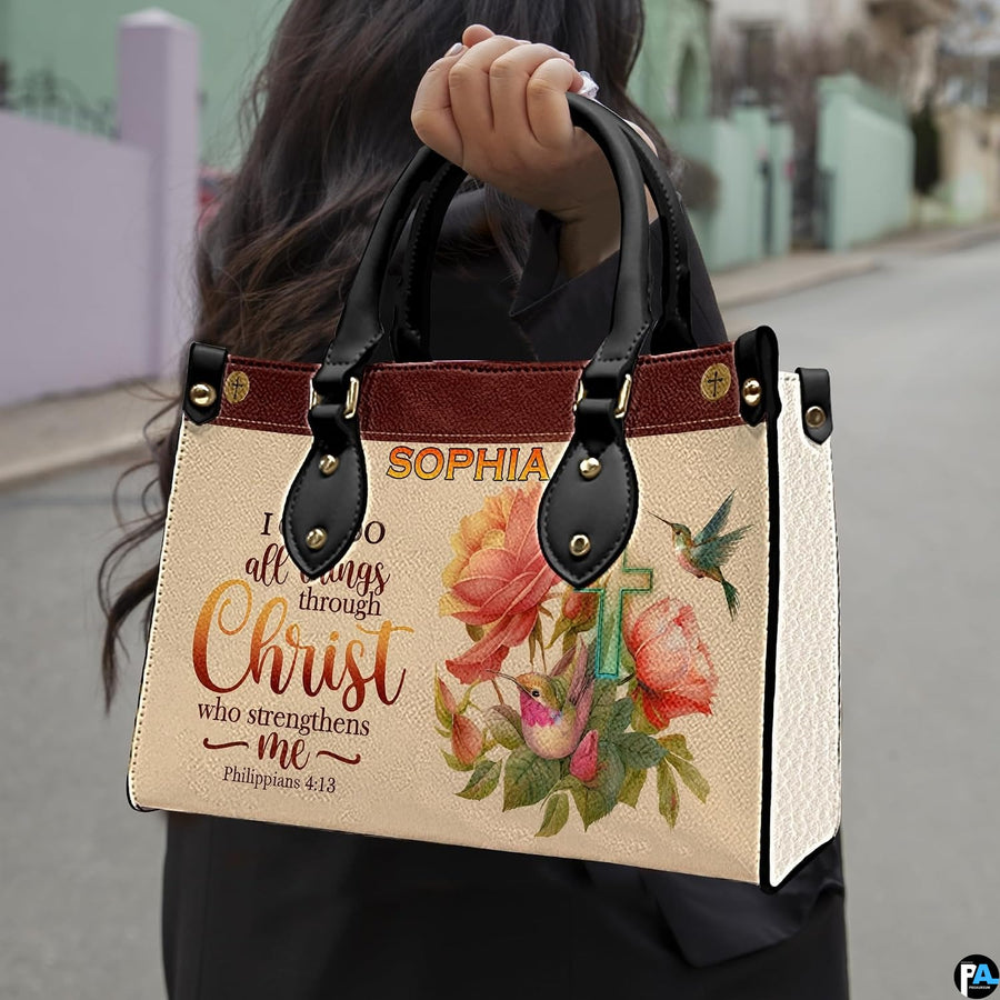 Woman carrying the peach rose scripture handbag outdoors along a sunny street.