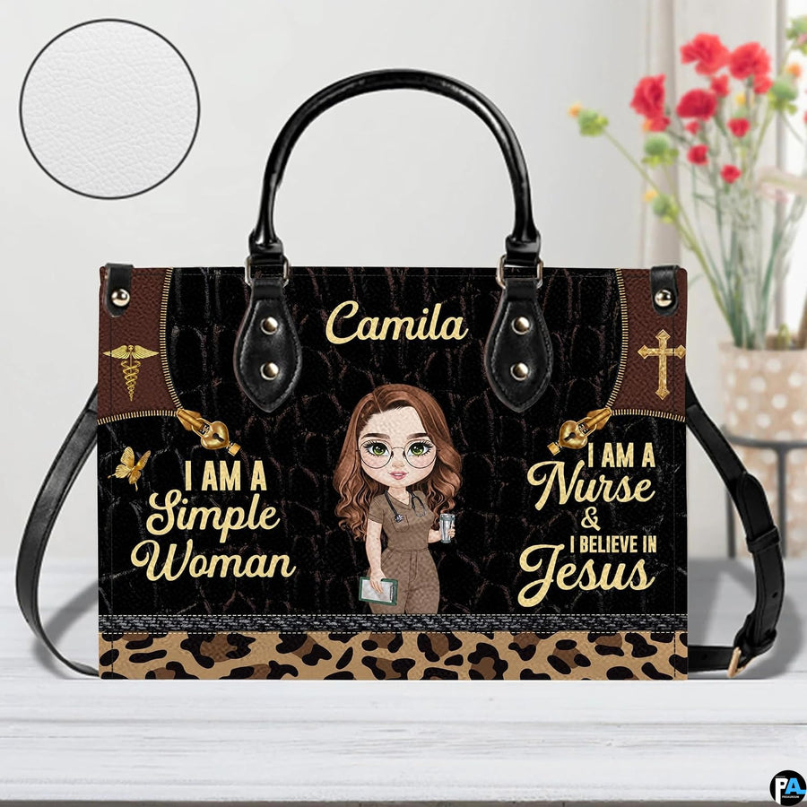 Christian nurse handbag displayed indoors alongside floral vase with circular texture swatch.
