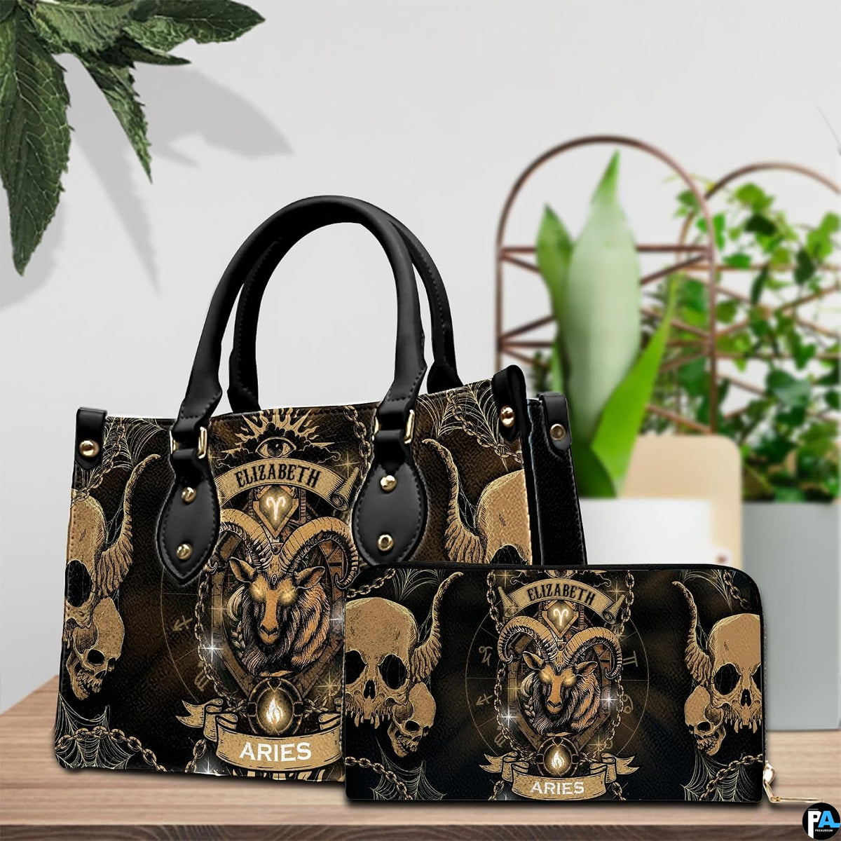 Gothic Ram Zodiac Handbag and continental wallet set showcased on a wooden table beside plants.