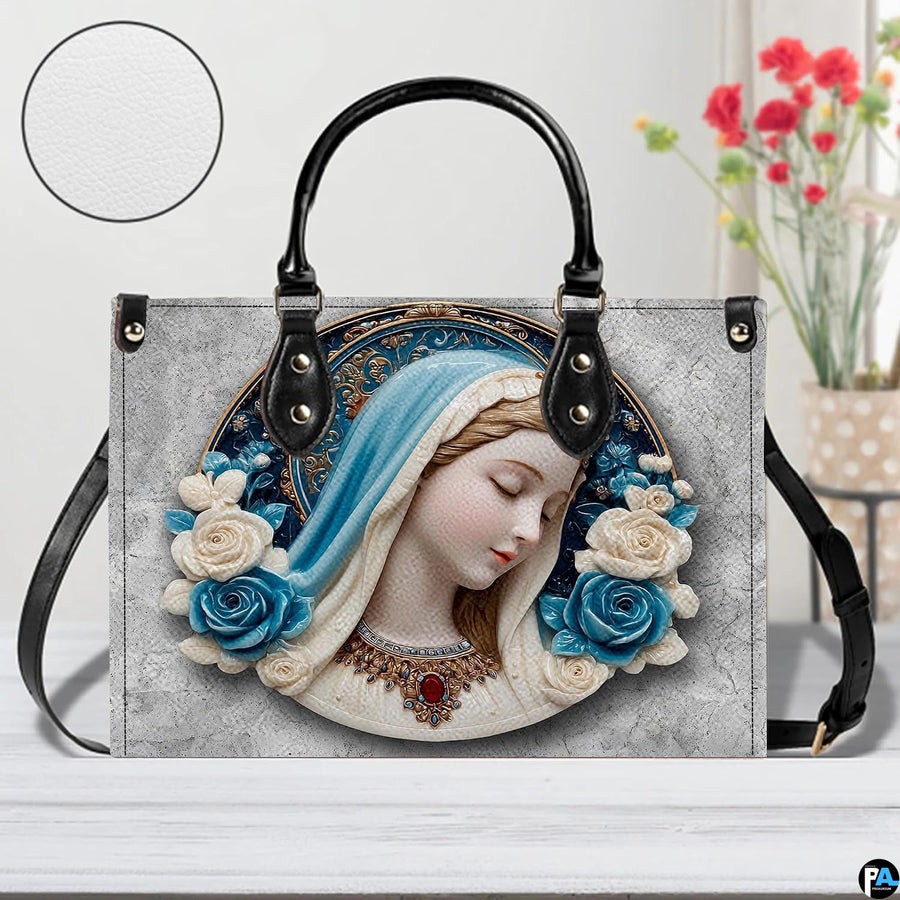 Devotional Virgin Mary cerulean rose cameo handbag displayed on white tabletop