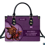 Fantasy book dragon violet handbag displayed alone on white studio background.