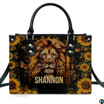 Side profile view of structured lion sunflower cross handbag.