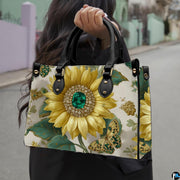 Model outdoors holding golden jeweled sunflower handbag
