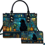 Studio presentation of cat on crescent moon stained glass art beside matching companion accessory.