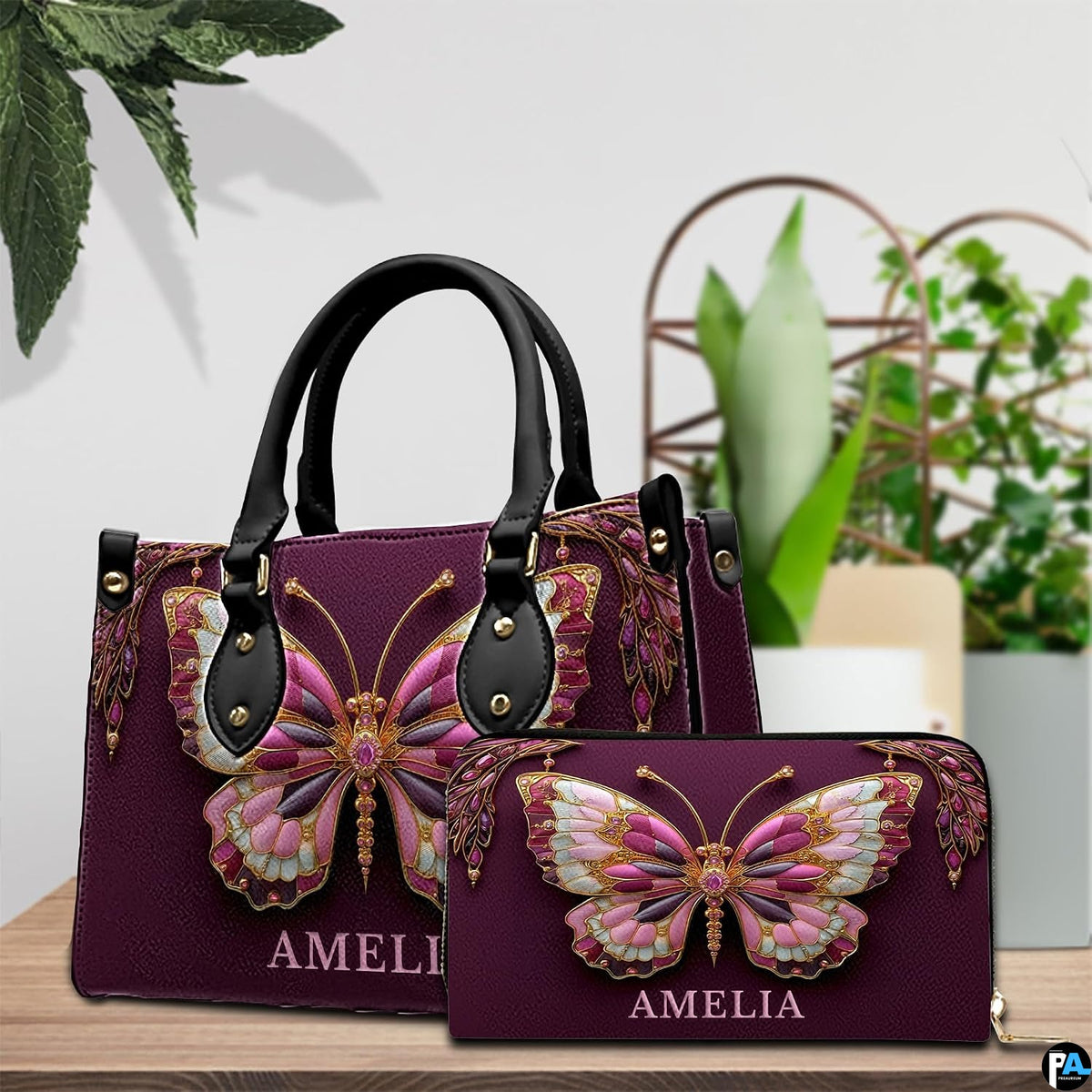 Jeweled butterfly handbag and matching wallet displayed on tabletop setting