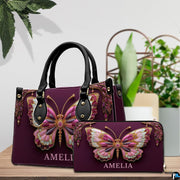 Jeweled butterfly handbag and matching wallet displayed on tabletop setting
