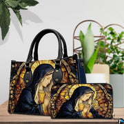 Stained glass Mary handbag and matching wallet displayed together with potted greenery