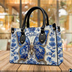 Alternative perspective angle of blue butterfly handbag and wallet