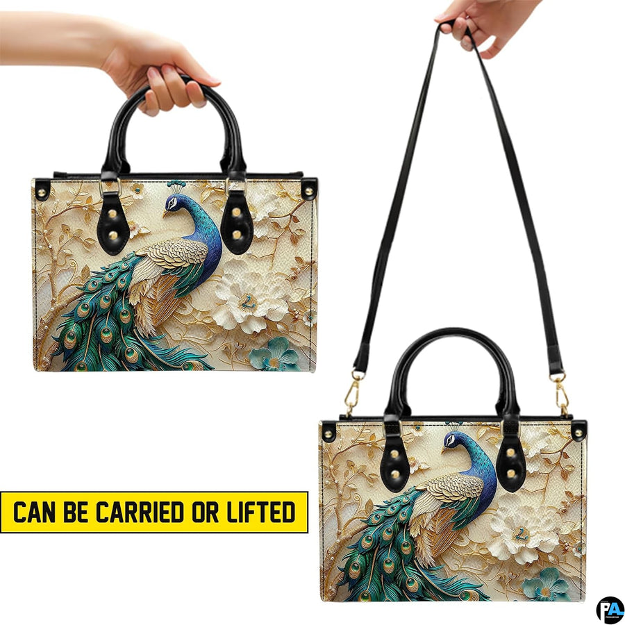 Peacock floral handbag shown with top handles and long strap