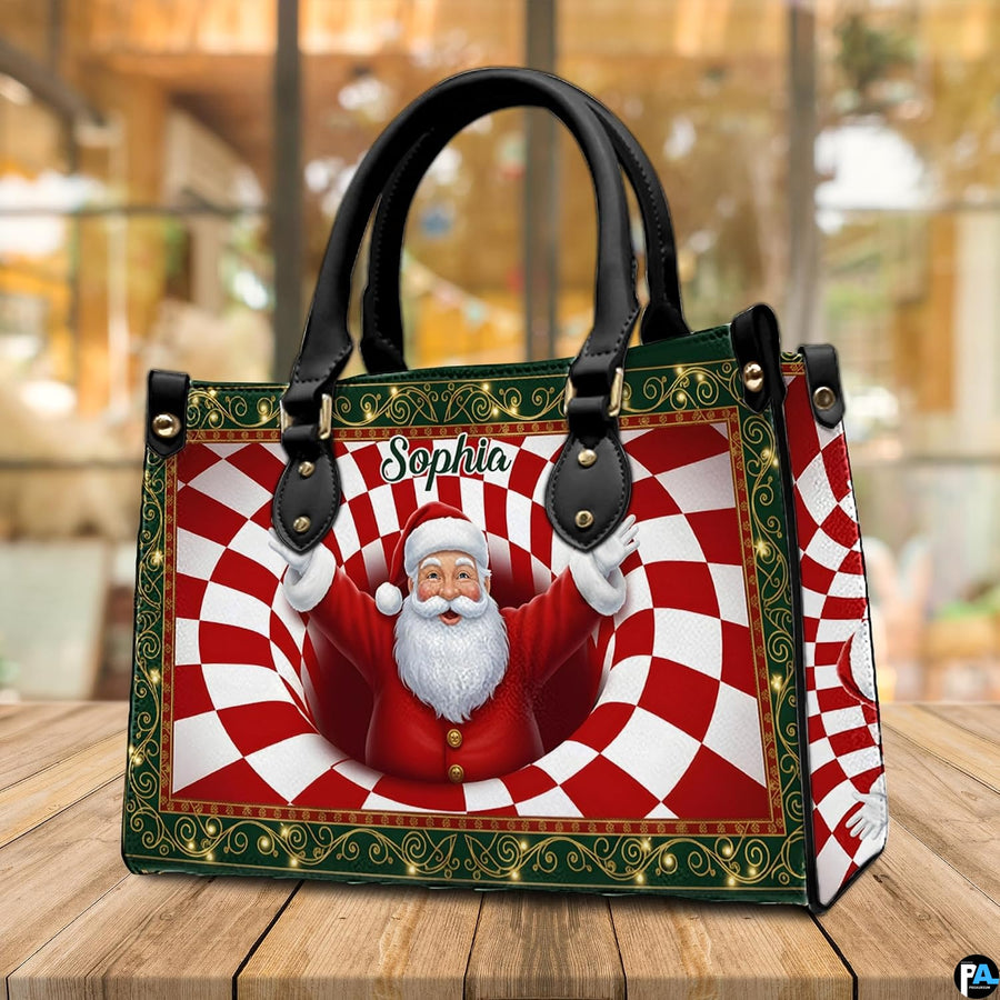 Holiday handbag displayed on a wooden table highlighting the dimensional Santa spiral illustration.