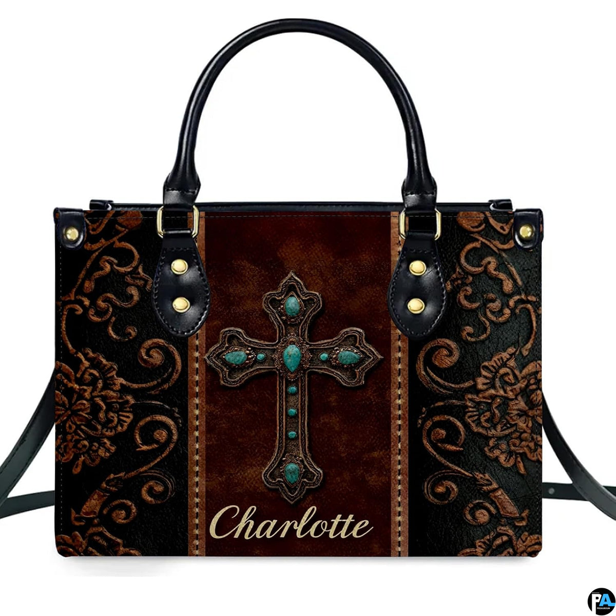 Angled perspective view of western turquoise cross handbag displaying ornate scroll patterns.