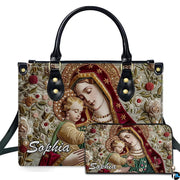 Embroidered Virgin Mary Madonna and Child artwork on coordinated handbag and wallet set