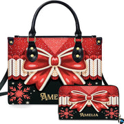 Christmas bow handbag featuring sparkling red glitter upper half and snowflake pattern on black lower panel.