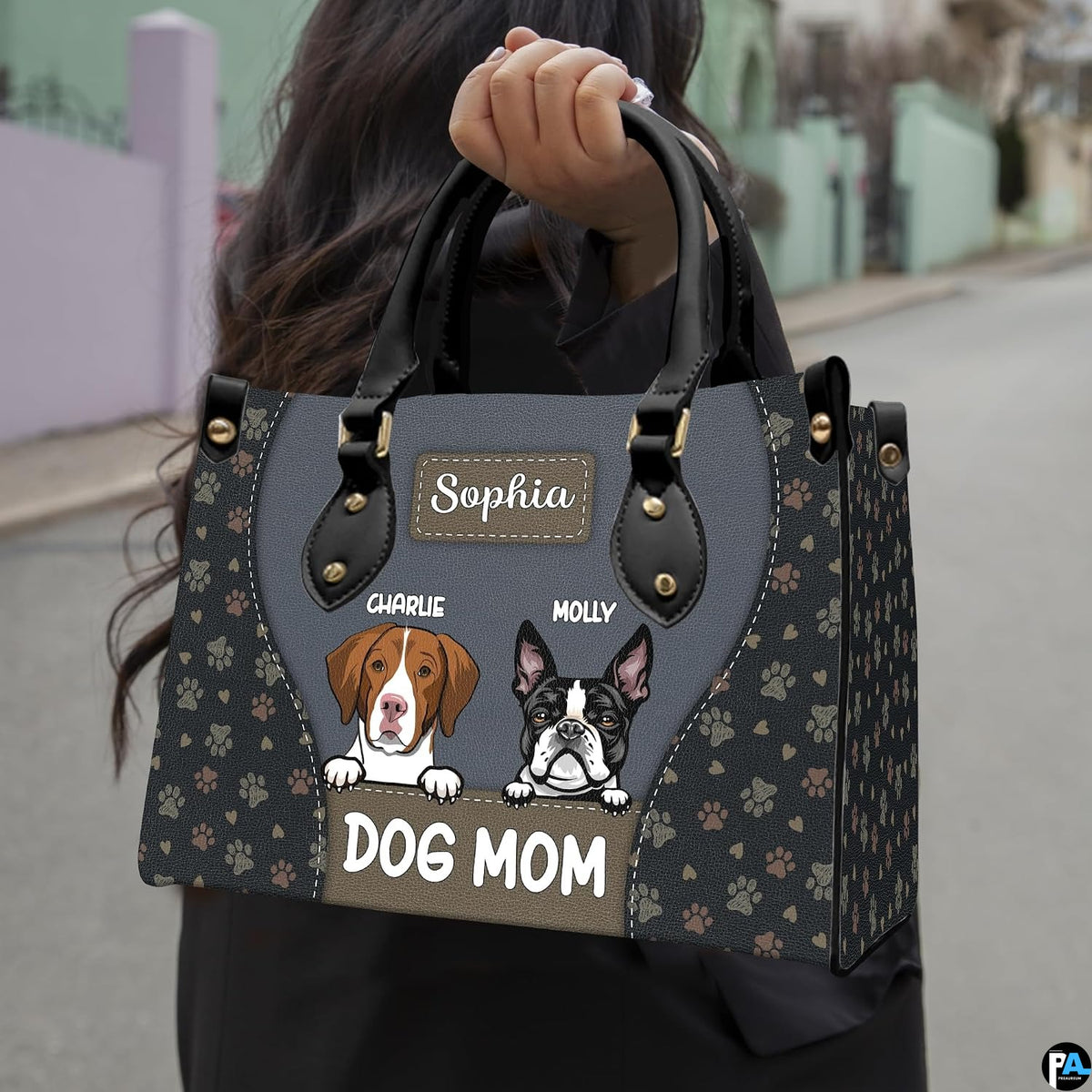 Side view of slate canine handbag displaying structured silhouette and clean profile.