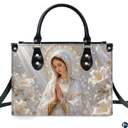 Lifestyle display of pearlescent Madonna handbag carried by model showing artwork and scale