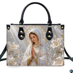 Lifestyle display of pearlescent Madonna handbag carried by model showing artwork and scale