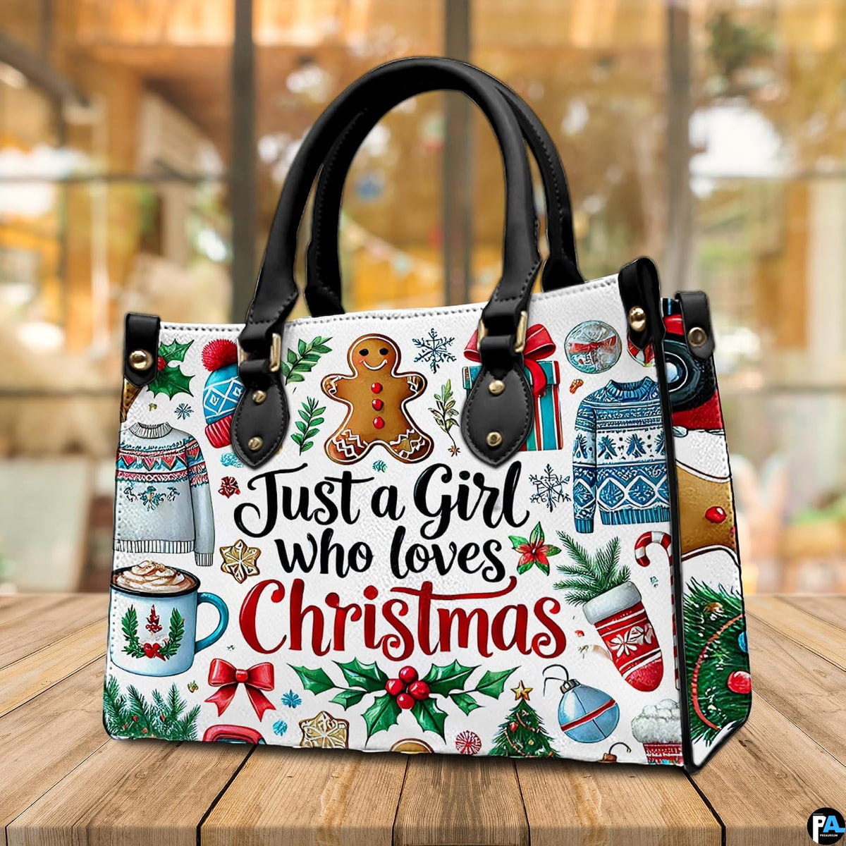 Side perspective view of hot cocoa purse highlighting structured shape and carrying handles.