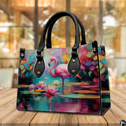 Lifestyle model display showing the pink flamingo handbag carried over the shoulder.