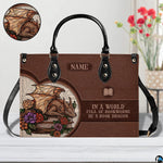 Close-up detail of handbag highlighting golden dragon scales, blooming roses, and vintage print backdrop