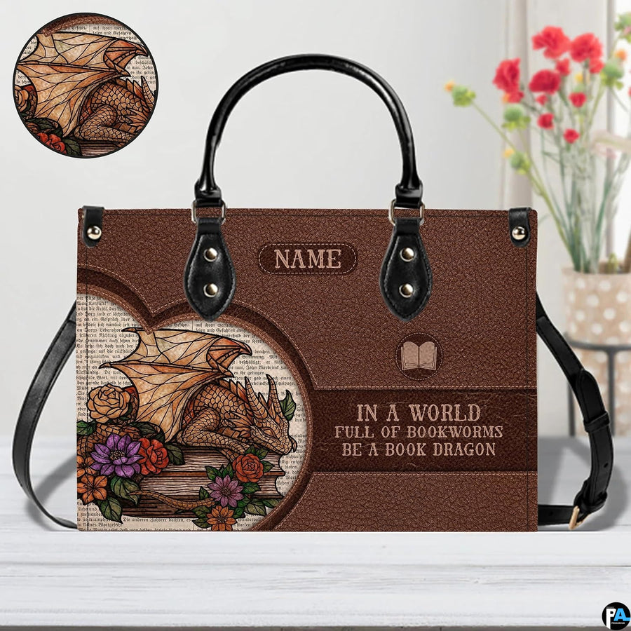 Close-up detail of handbag highlighting golden dragon scales, blooming roses, and vintage print backdrop