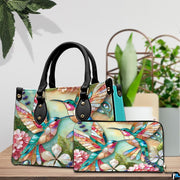Side profile view of turquoise hummingbird handbag displaying structured silhouette and depth.