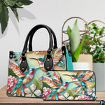 Side profile view of turquoise hummingbird handbag displaying structured silhouette and depth.