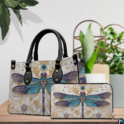 Coordinated arrangement of handbag and wallet displaying the matching dragonfly design.