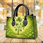 Angled clover tree handbag with dense green ground cover and gold sparkles