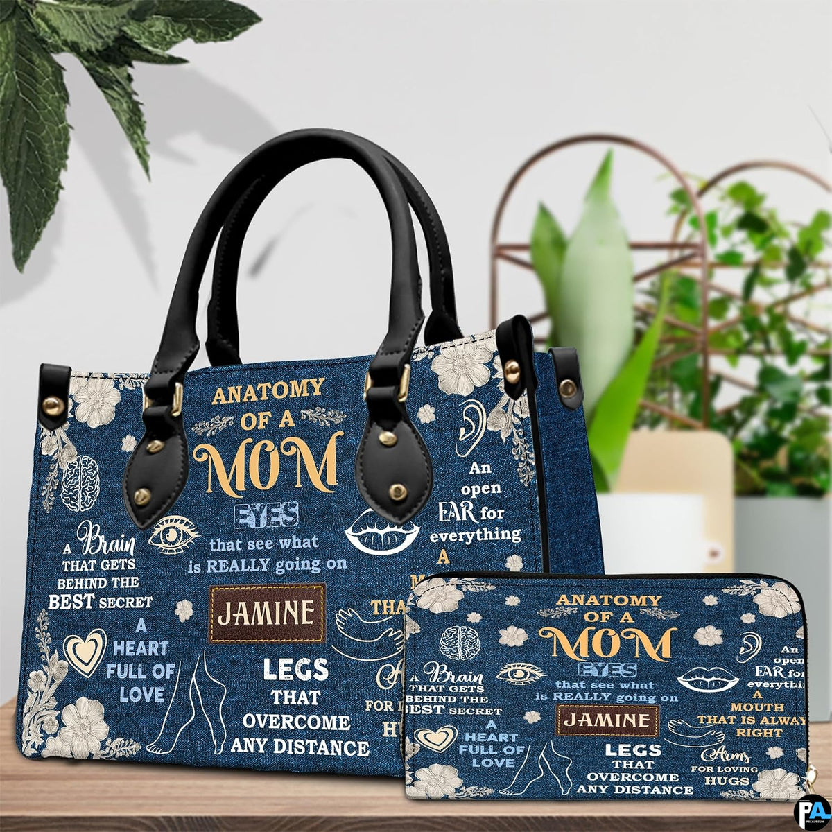 Studio presentation of indigo botanical art accessory paired beside matching zip companion item.