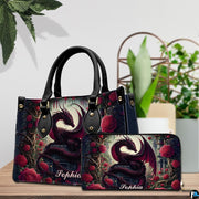 Gothic dragon handbag and wallet set displayed on wooden table beside houseplant.