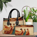 Handbag and matching companion wallet positioned on tabletop with potted plants in the background.