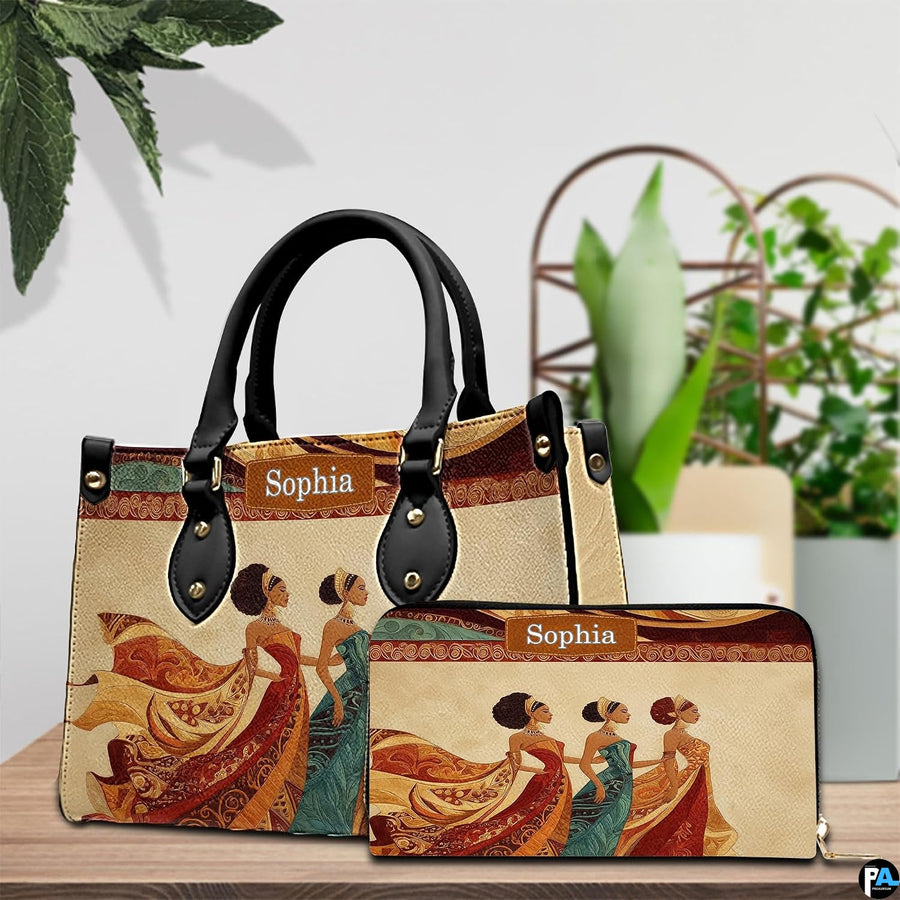 Handbag and matching companion wallet positioned on tabletop with potted plants in the background.