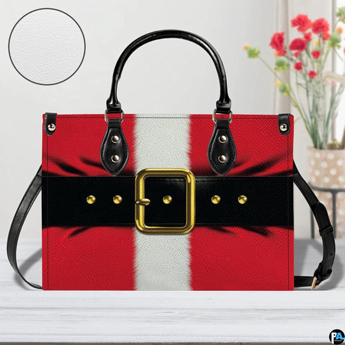 Front display of Santa Claus suit handbag staged on a light wooden table alongside a decorative floral vase.