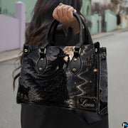 Street perspective of person holding the gothic witch artwork accessory highlighting the nocturnal moonlit scene.