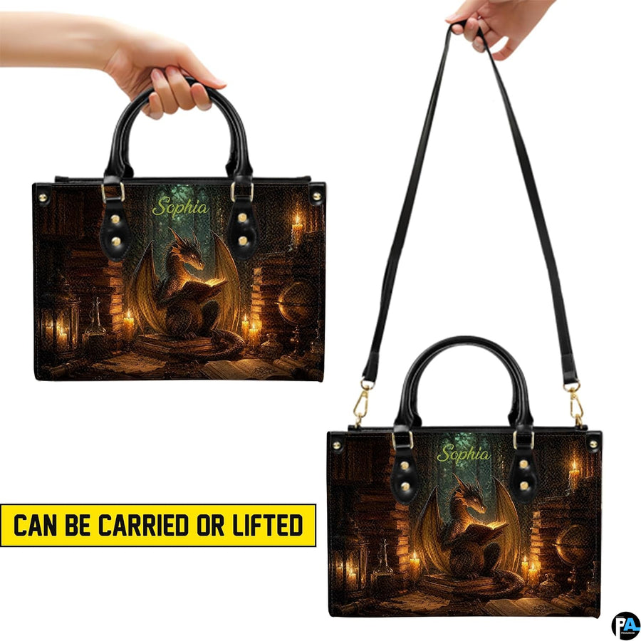Bottom view of alchemist dragon handbag showing protective gold base hardware