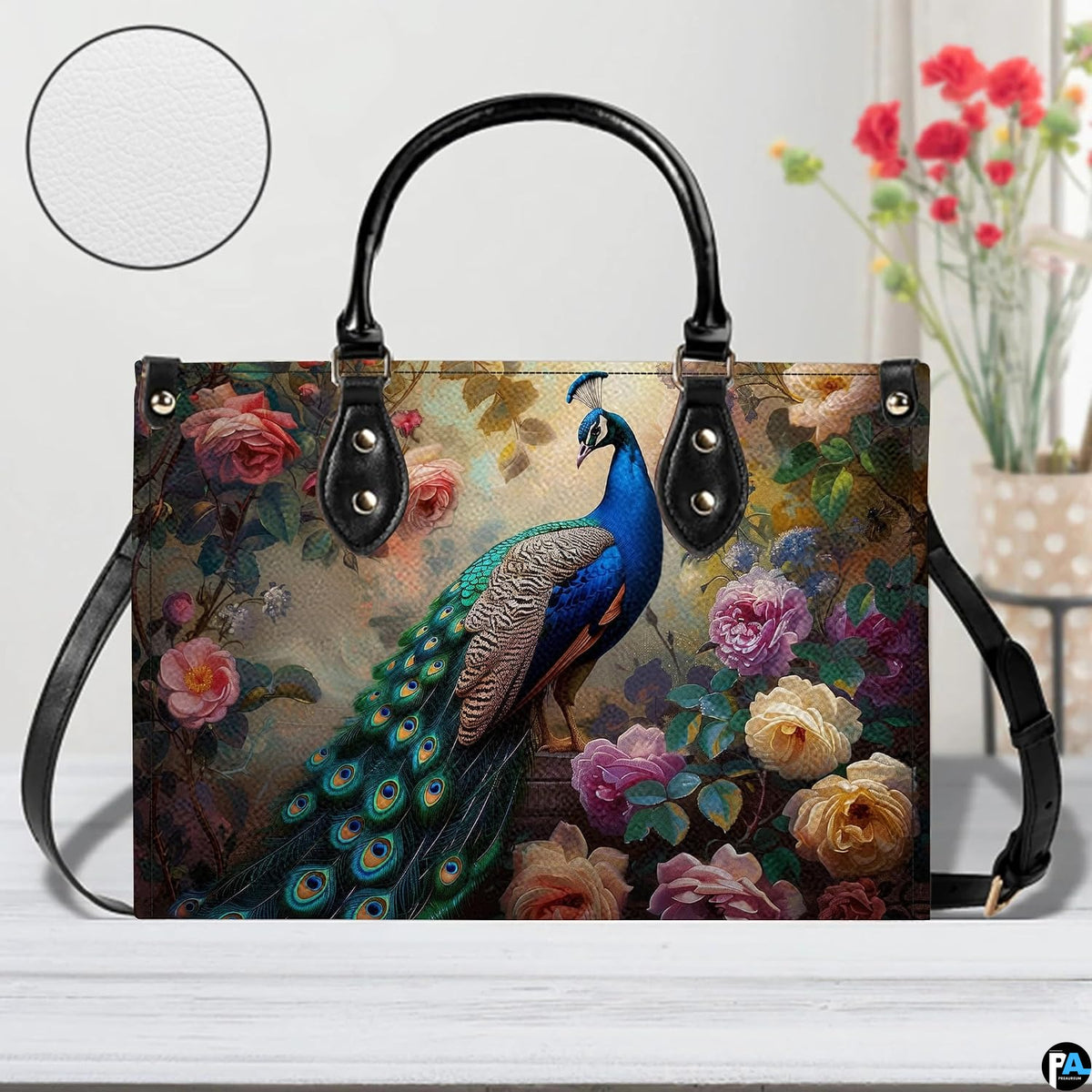 Peacock rose handbag shown with long carrying strap and detail inset