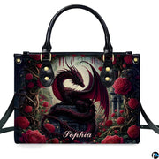Studio front view of structured red rose dragon handbag with attached shoulder strap.