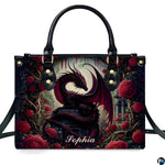 Studio front view of structured red rose dragon handbag with attached shoulder strap.