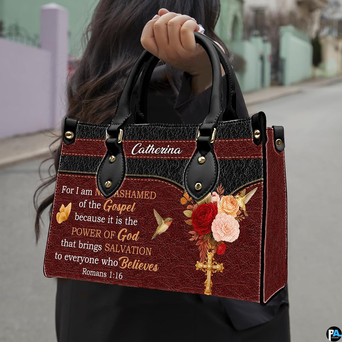 Detailed view of red and peach rose bouquet with hovering hummingbirds and golden butterflies on handbag.