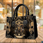 Angled perspective view of Gothic Ram Zodiac Handbag placed on a wooden deck table.