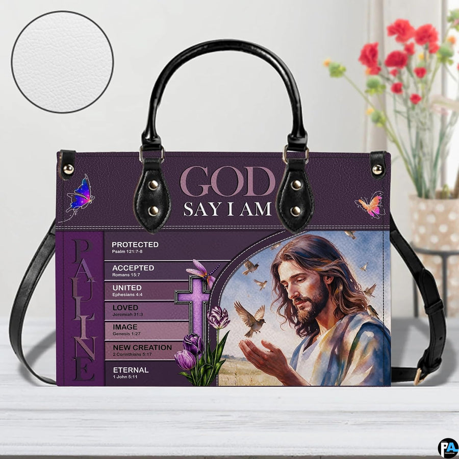 Jesus scripture handbag on white table beside floral bouquet with texture swatch inset.